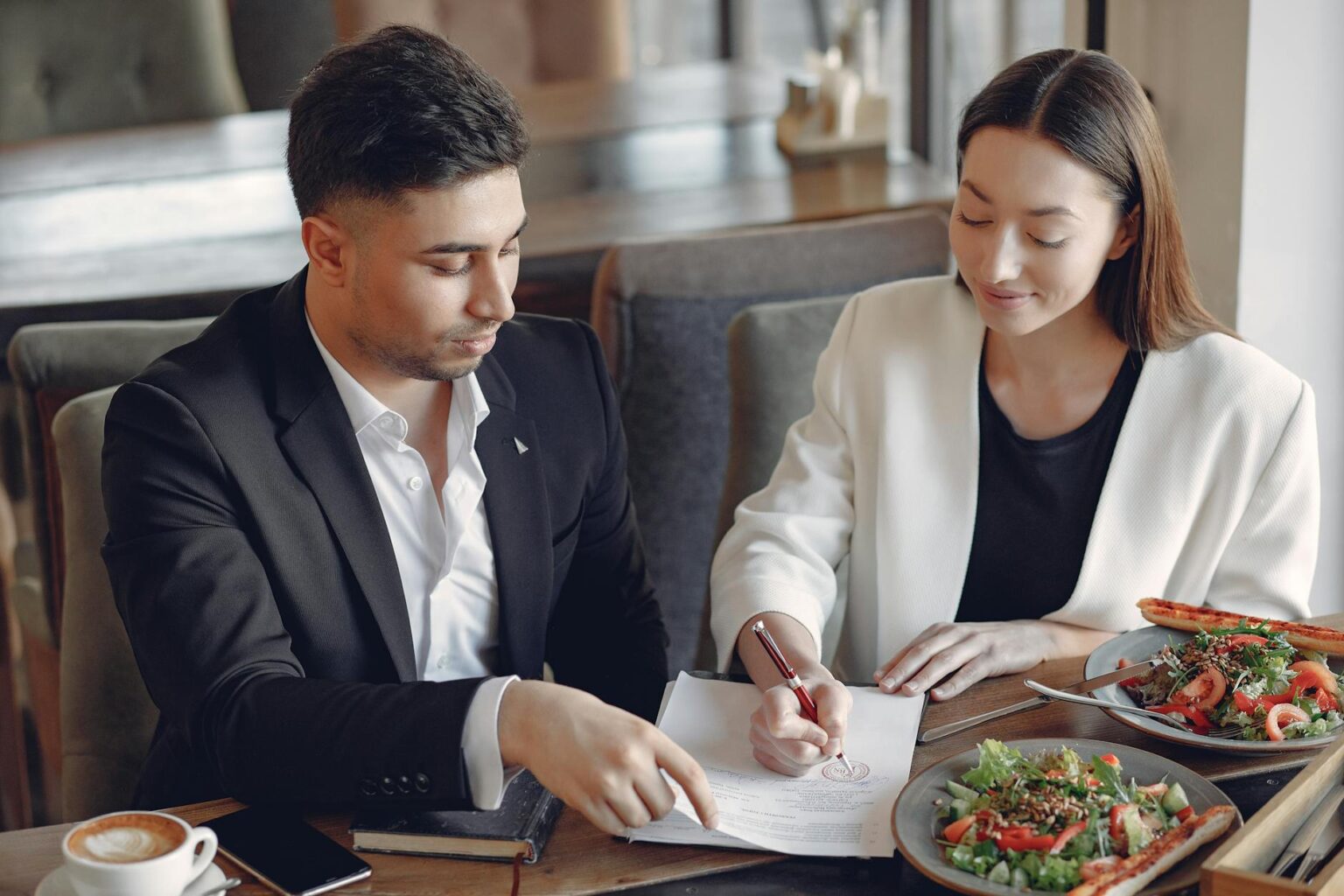 Business professionals having lunch meeting at downtown restaurant