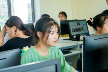 Gaming Companies Pivot to Educational Software as School Districts Increase Tech Budgets Students using computers in a modern classroom with digital learning technology