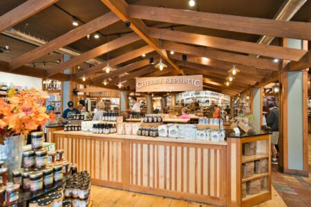 Major Retailers Experiment With Four-Day Customer Service Weeks Modern retail store interior with customer service counter and shopping area