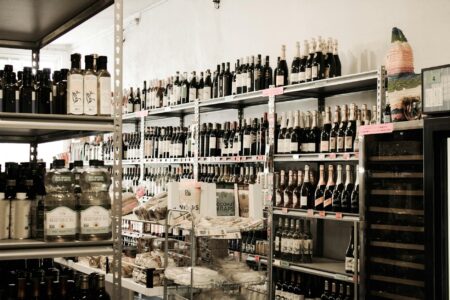 Major Food Brands Acquire Plant-Based Startups to Capture Health Trends Modern grocery store aisle with shelves of food products