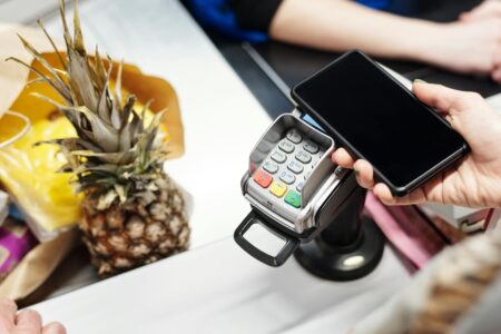 Major Retailers Abandon Self-Checkout as Theft Losses Mount Modern retail checkout area with both self-service kiosks and traditional cashier stations