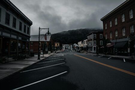 Charming main street in a small American town with local businesses and tree-lined sidewalks