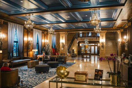 Modern hotel lobby with contemporary seating and workspace areas