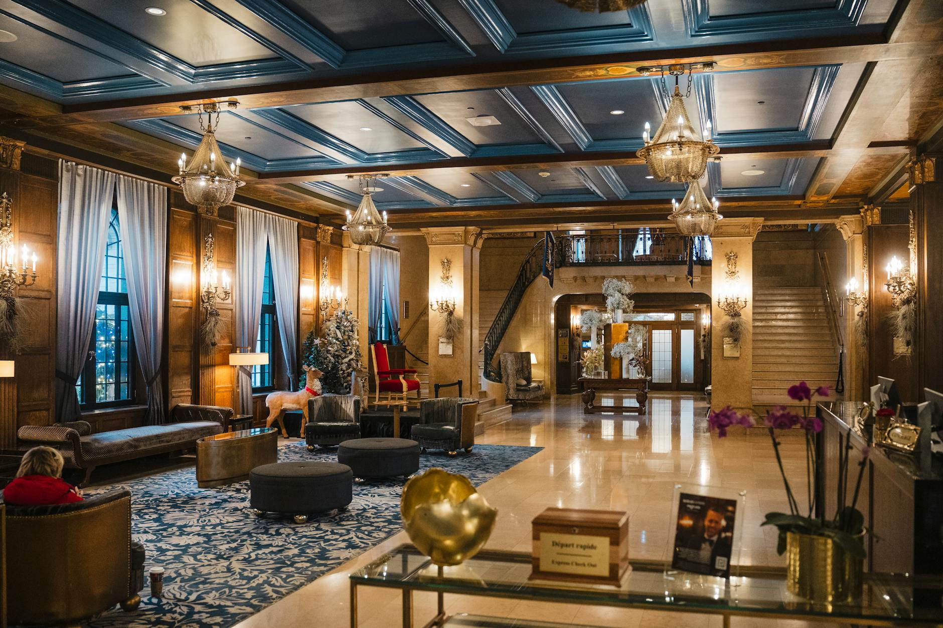 Modern hotel lobby with contemporary seating and workspace areas
