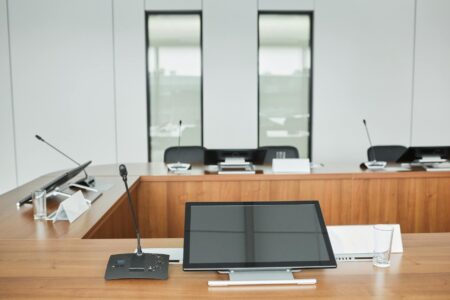 Modern corporate boardroom with executives discussing financial strategy and capital allocation decisions
