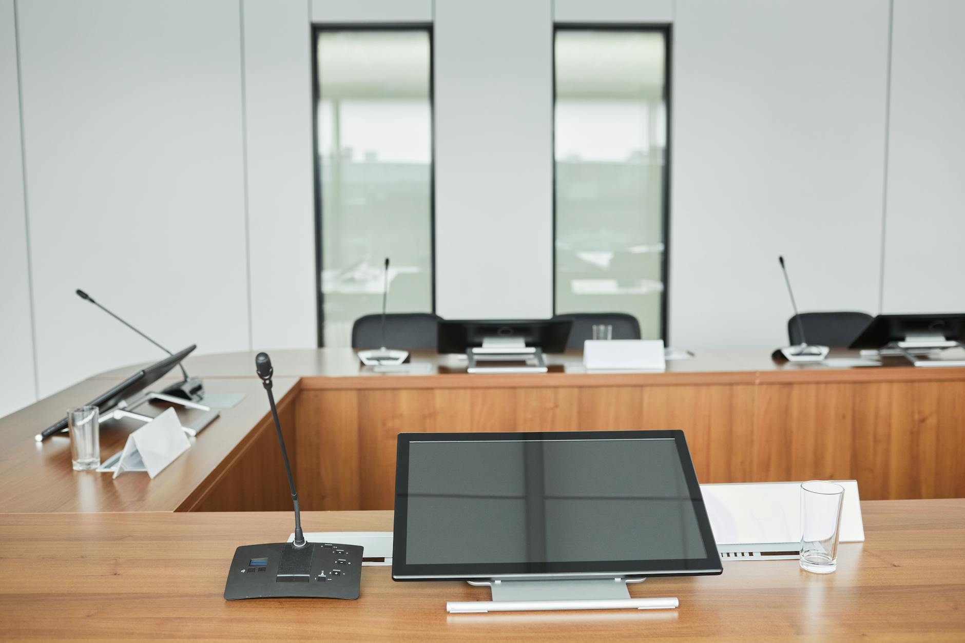 Modern corporate boardroom with executives discussing financial strategy and capital allocation decisions