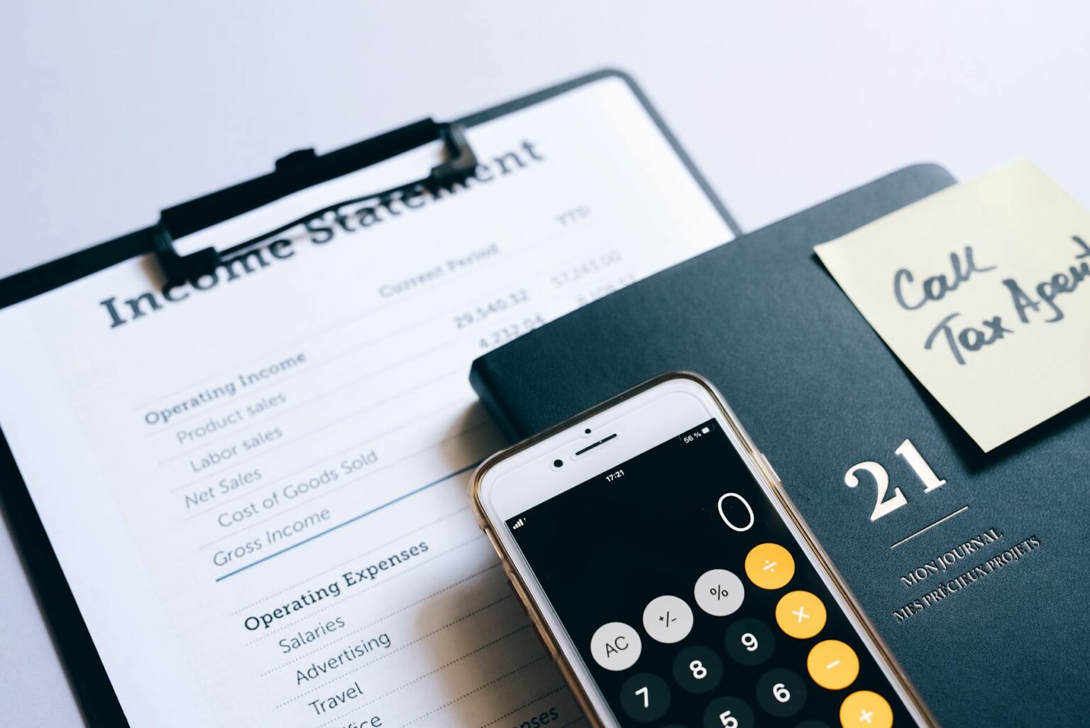 Asset-Backed Securities Make Comeback as Interest Rates Stabilize Financial documents and charts spread across a desk showing investment analysis