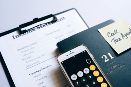 Asset-Backed Securities Make Comeback as Interest Rates Stabilize Financial documents and charts spread across a desk showing investment analysis