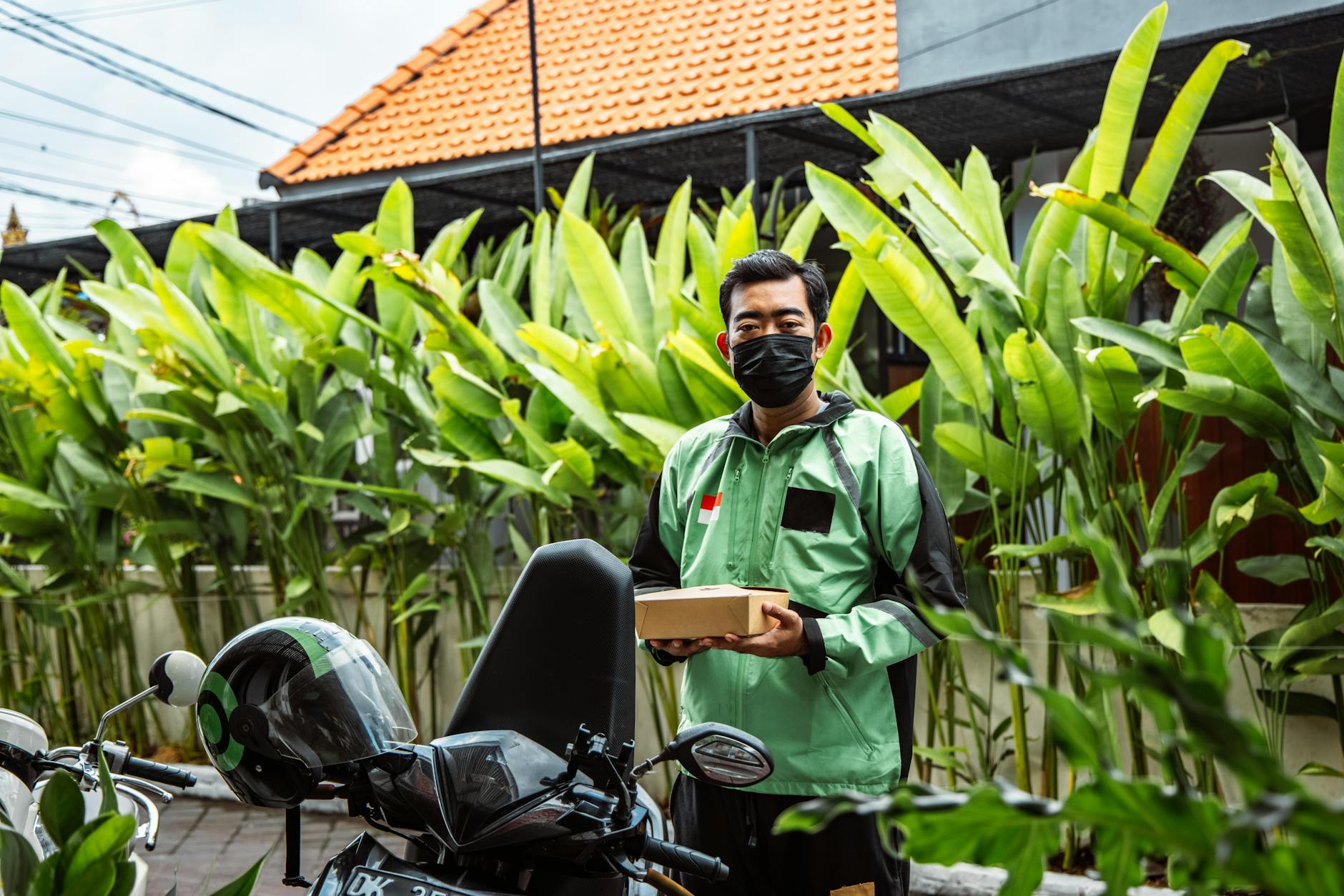 Delivery driver using smartphone app while working, representing gig economy workers