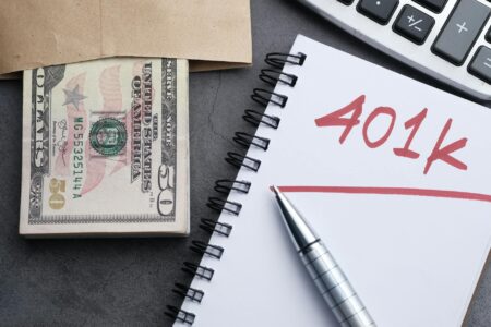 How Covered Call Strategies Are Helping Retirees Navigate Market Uncertainty Senior couple reviewing financial documents and investment portfolio