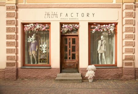 Modern retail storefront with large windows displaying products and clean interior design