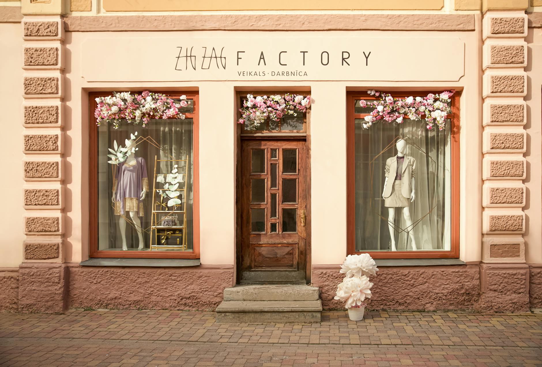 Modern retail storefront with large windows displaying products and clean interior design