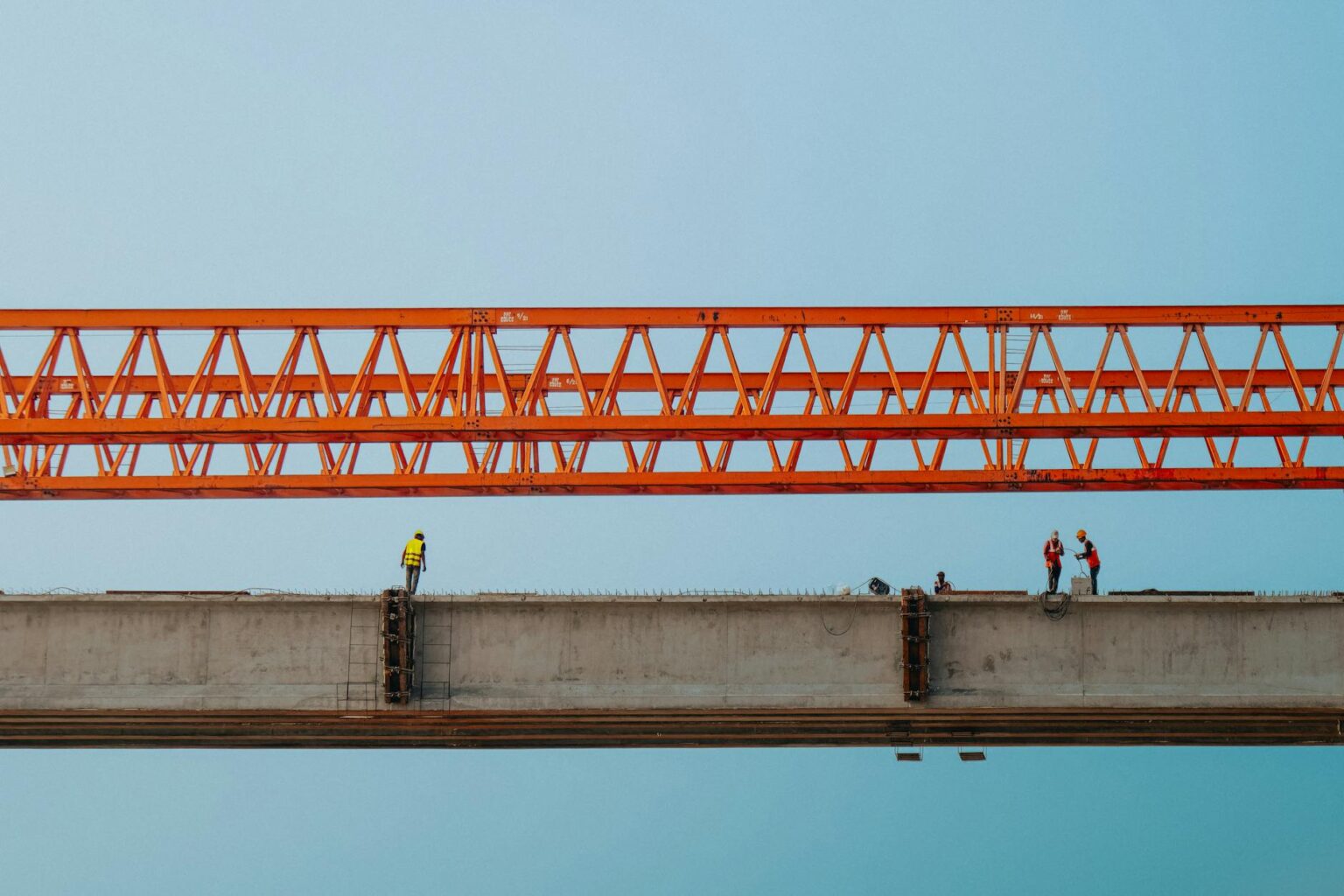 Municipal Bond Defaults Rise as Cities Face Infrastructure Repair Costs Construction work on aging infrastructure bridge with heavy machinery and repair equipment
