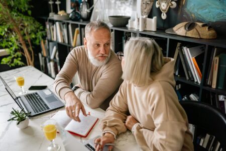 How Baby Boomers Are Shifting From Growth to Dividend Stocks Senior man reviewing investment portfolio on laptop computer