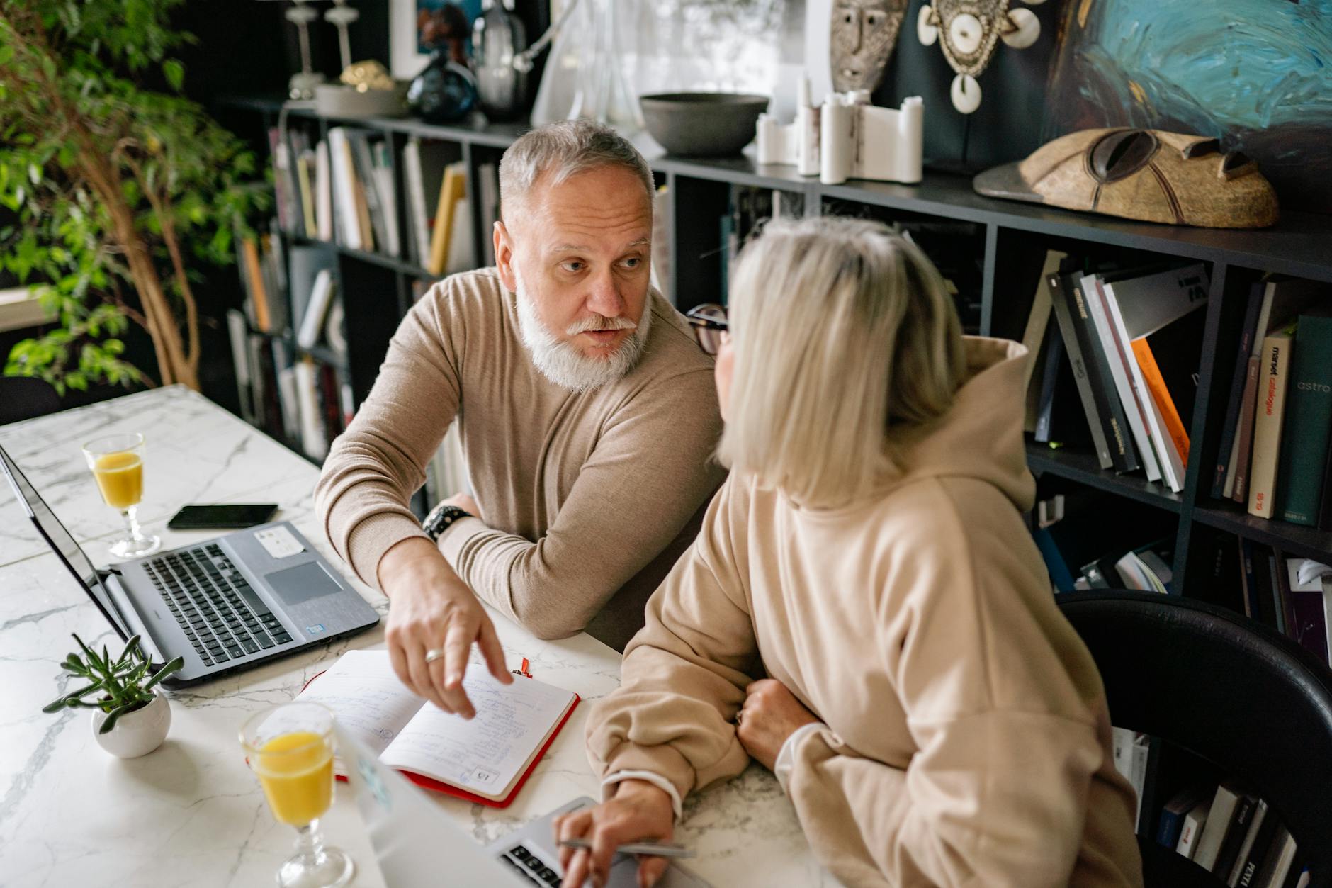 Senior man reviewing investment portfolio on laptop computer