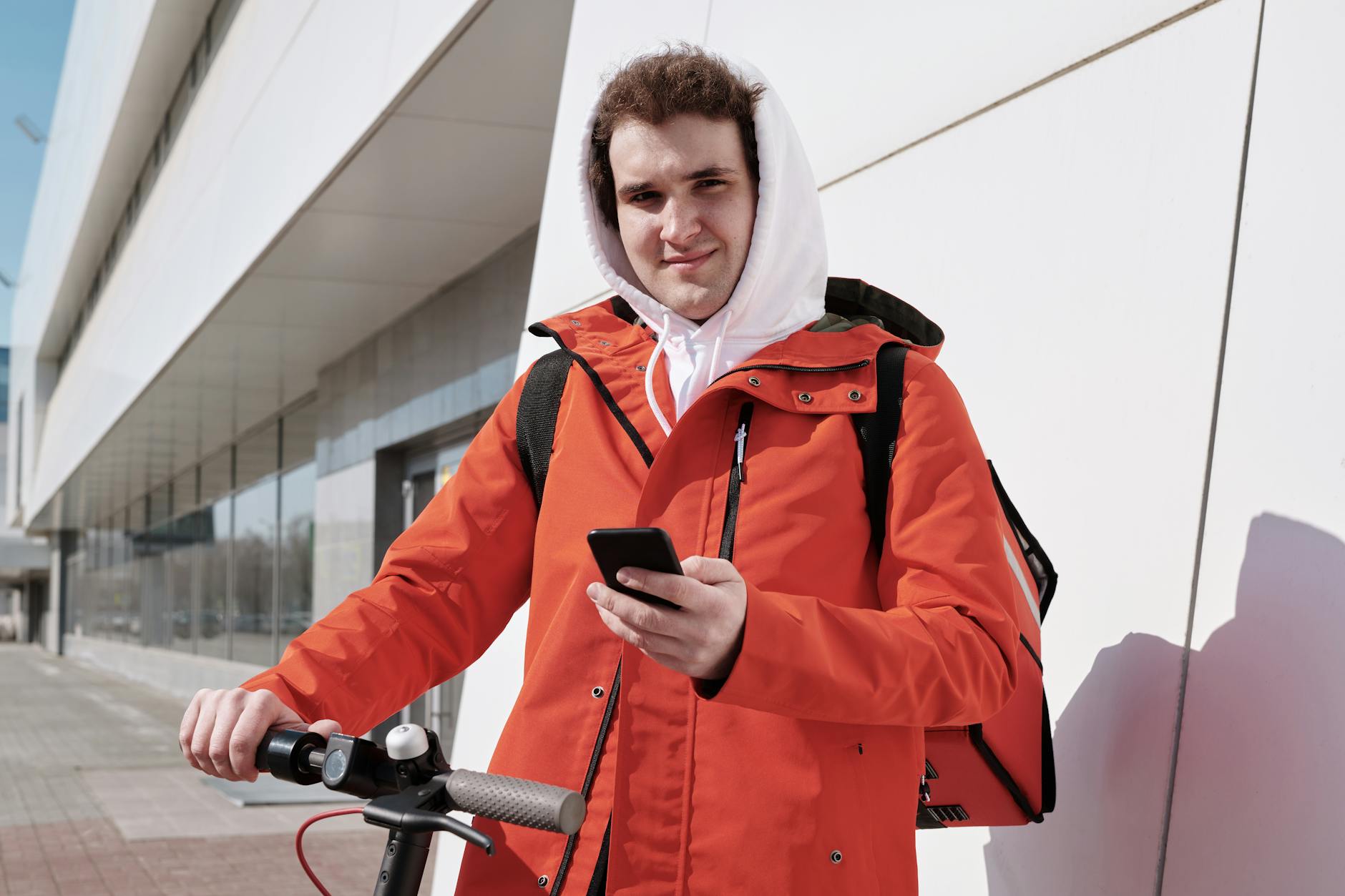 Person using smartphone food delivery app interface on mobile screen
