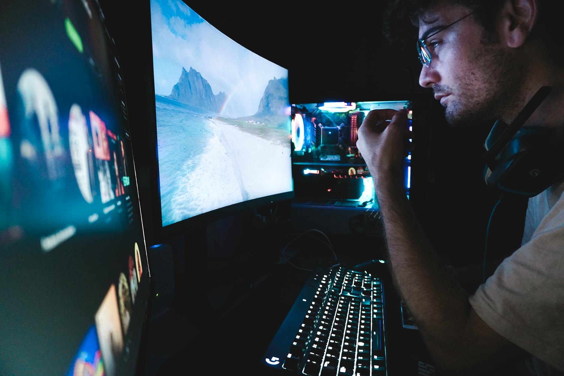 Software developers working on computer screens with code and digital graphics