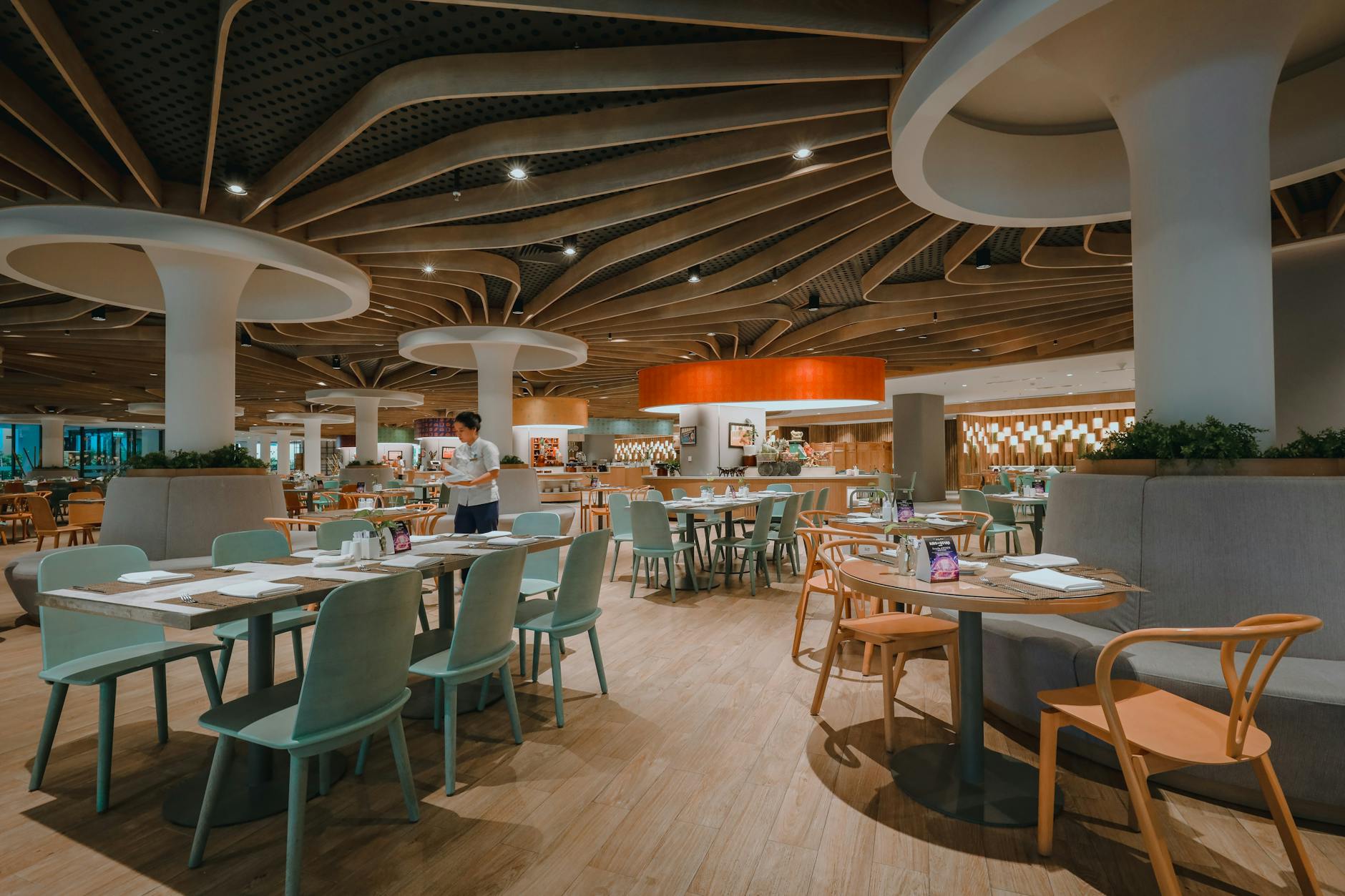 Empty restaurant dining room with tables and chairs