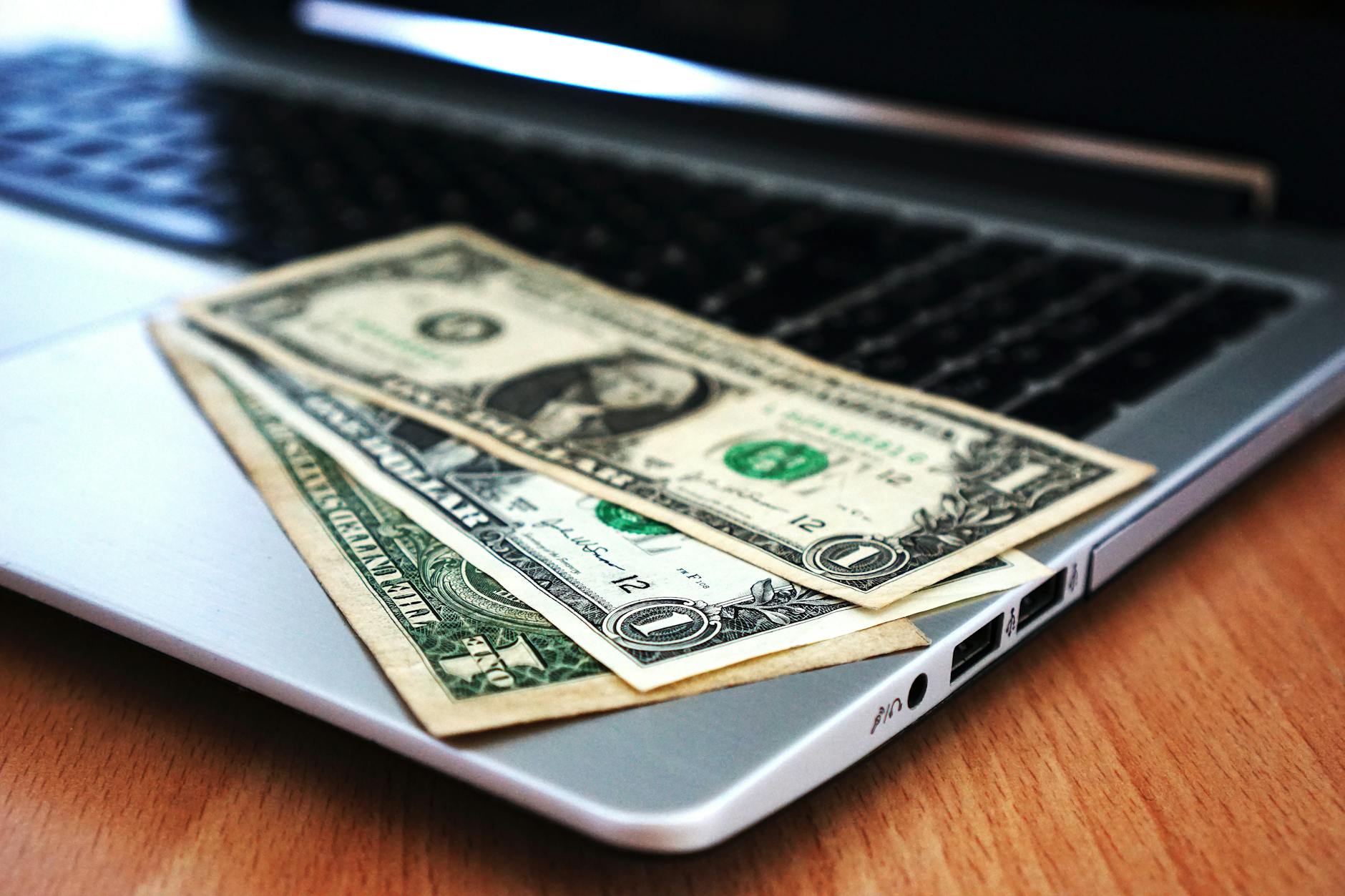 Person using laptop for online banking and investment management