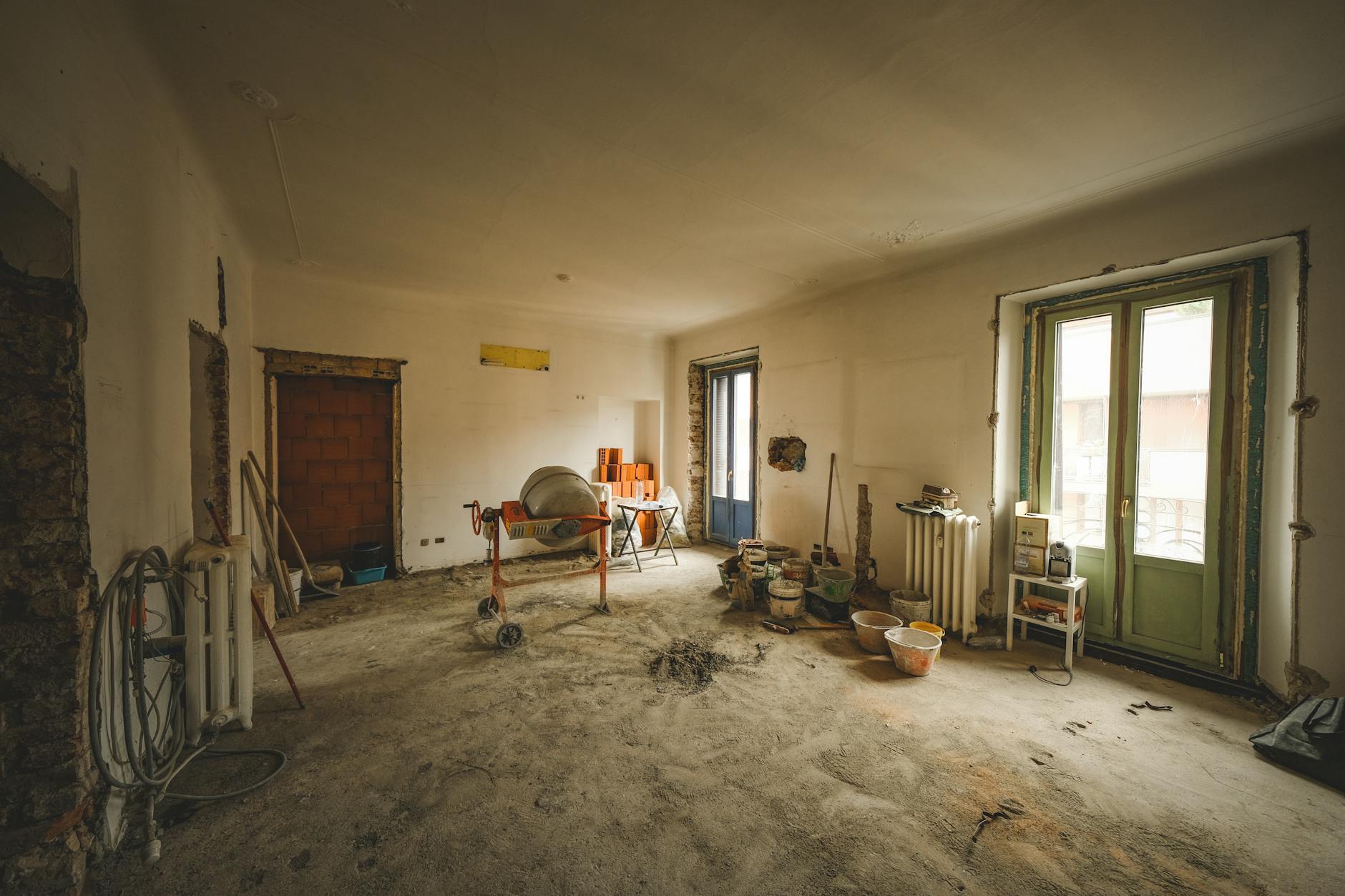 Construction workers renovating building interior during conversion project