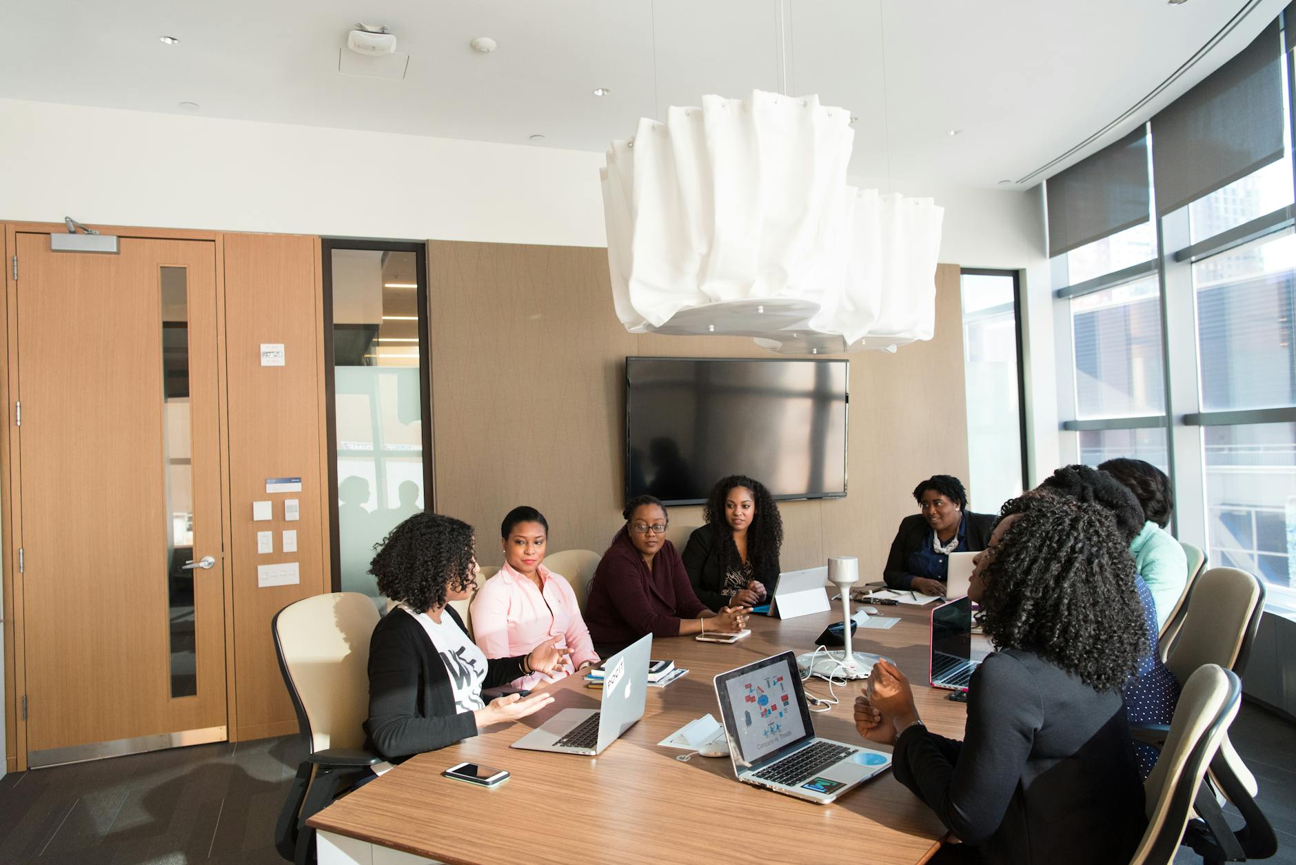 Corporate executives in business meeting discussing financial strategy and performance