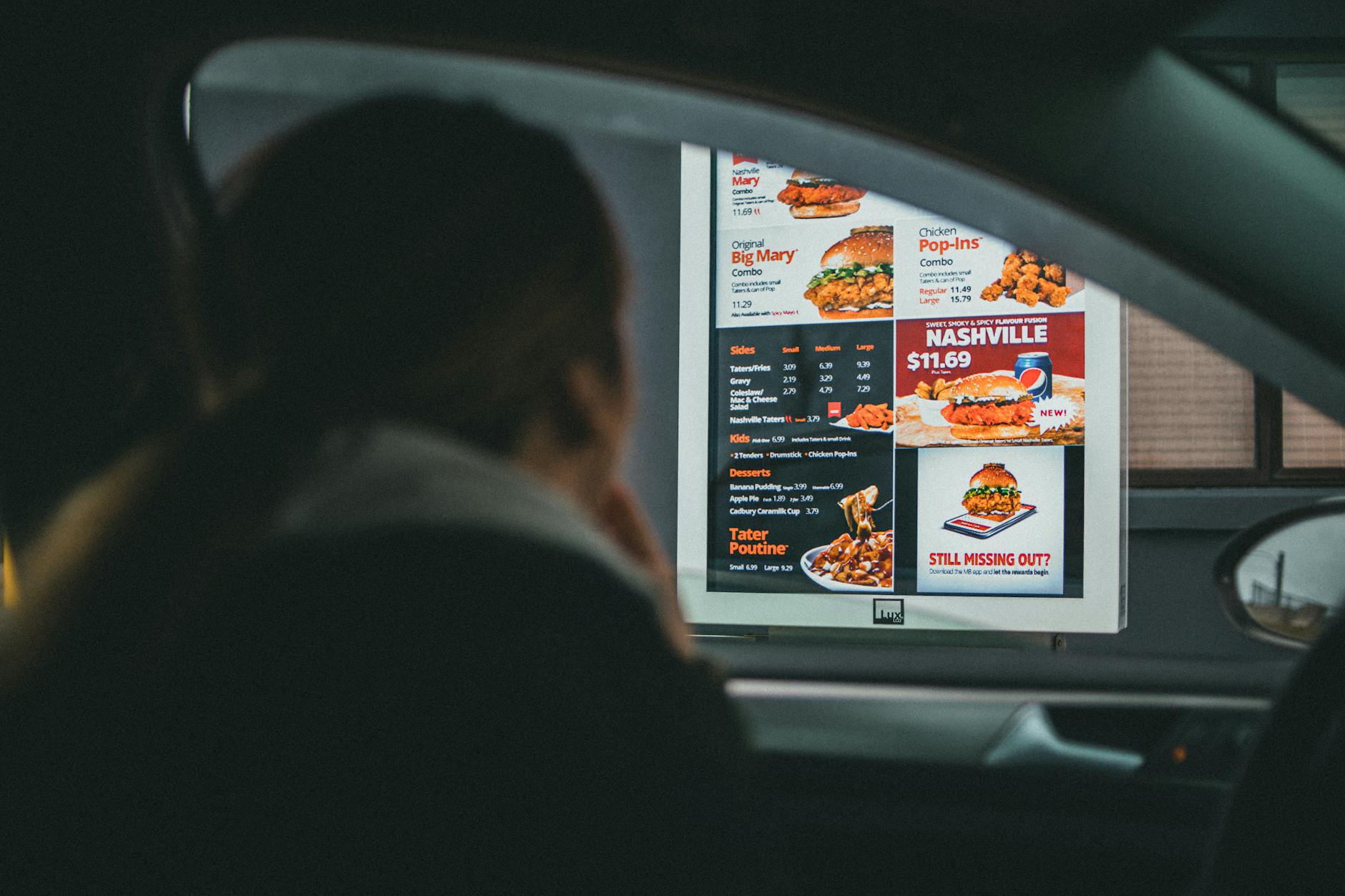 Digital menu board displaying fast casual restaurant pricing options