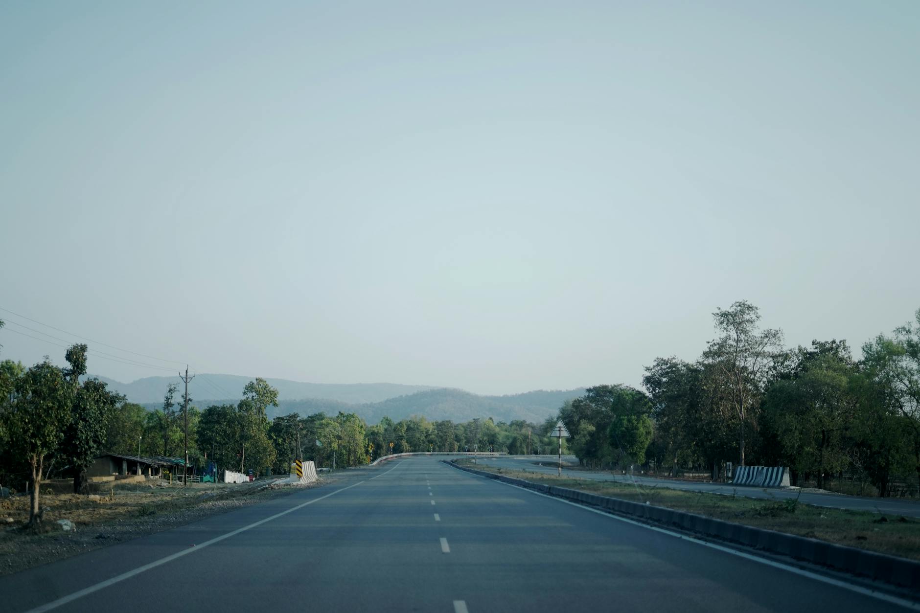 Rural highway stretching through small farming community
