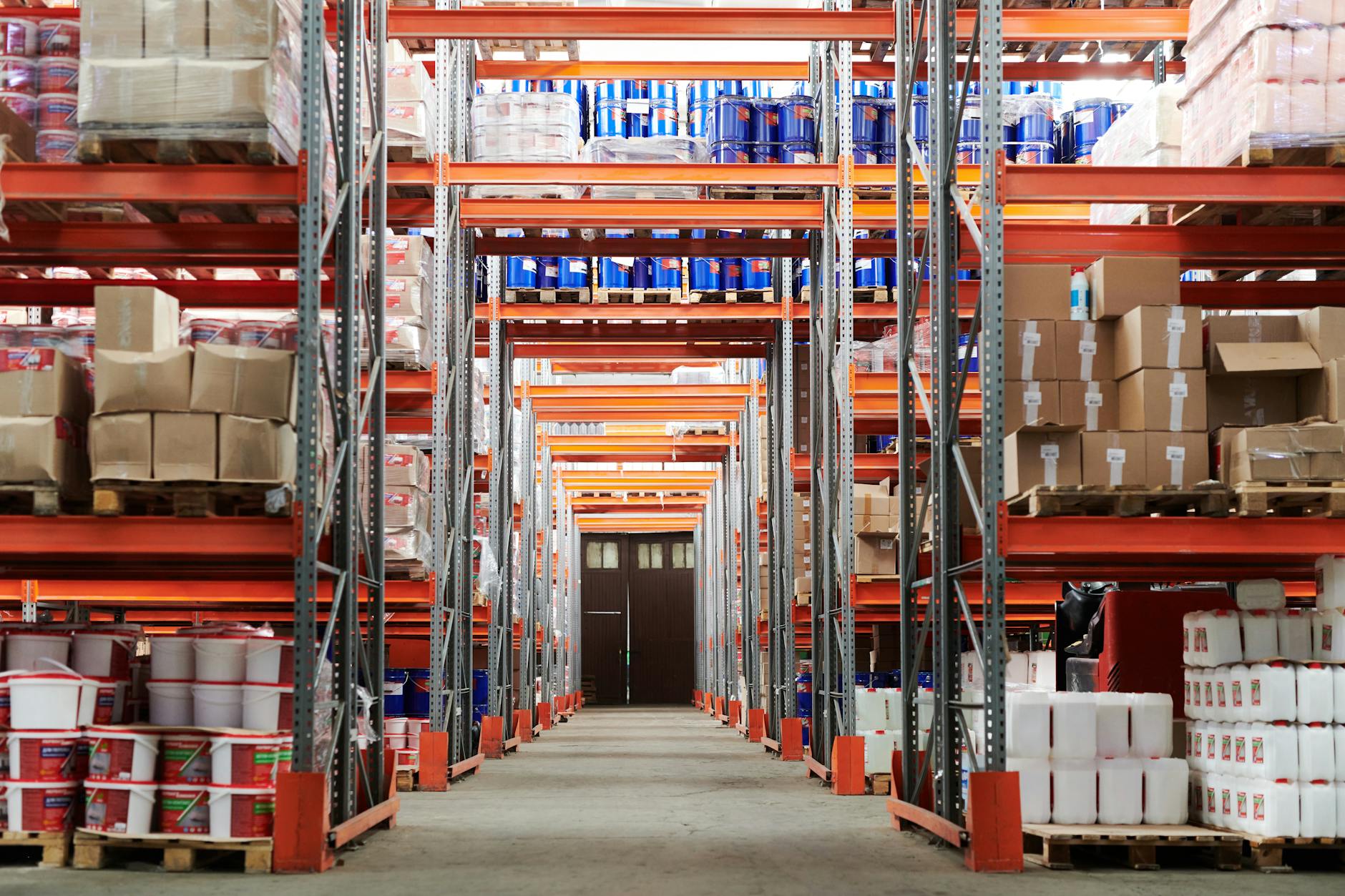 Interior view of large distribution center showing conveyor systems and package processing areas