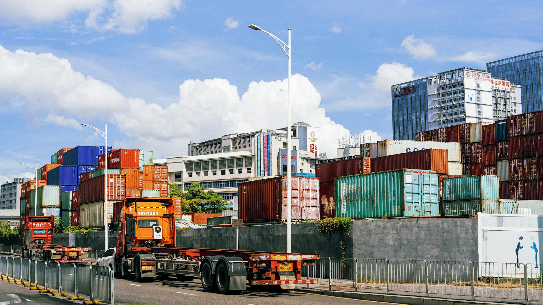 Advanced logistics control center with multiple screens displaying supply chain data and analytics