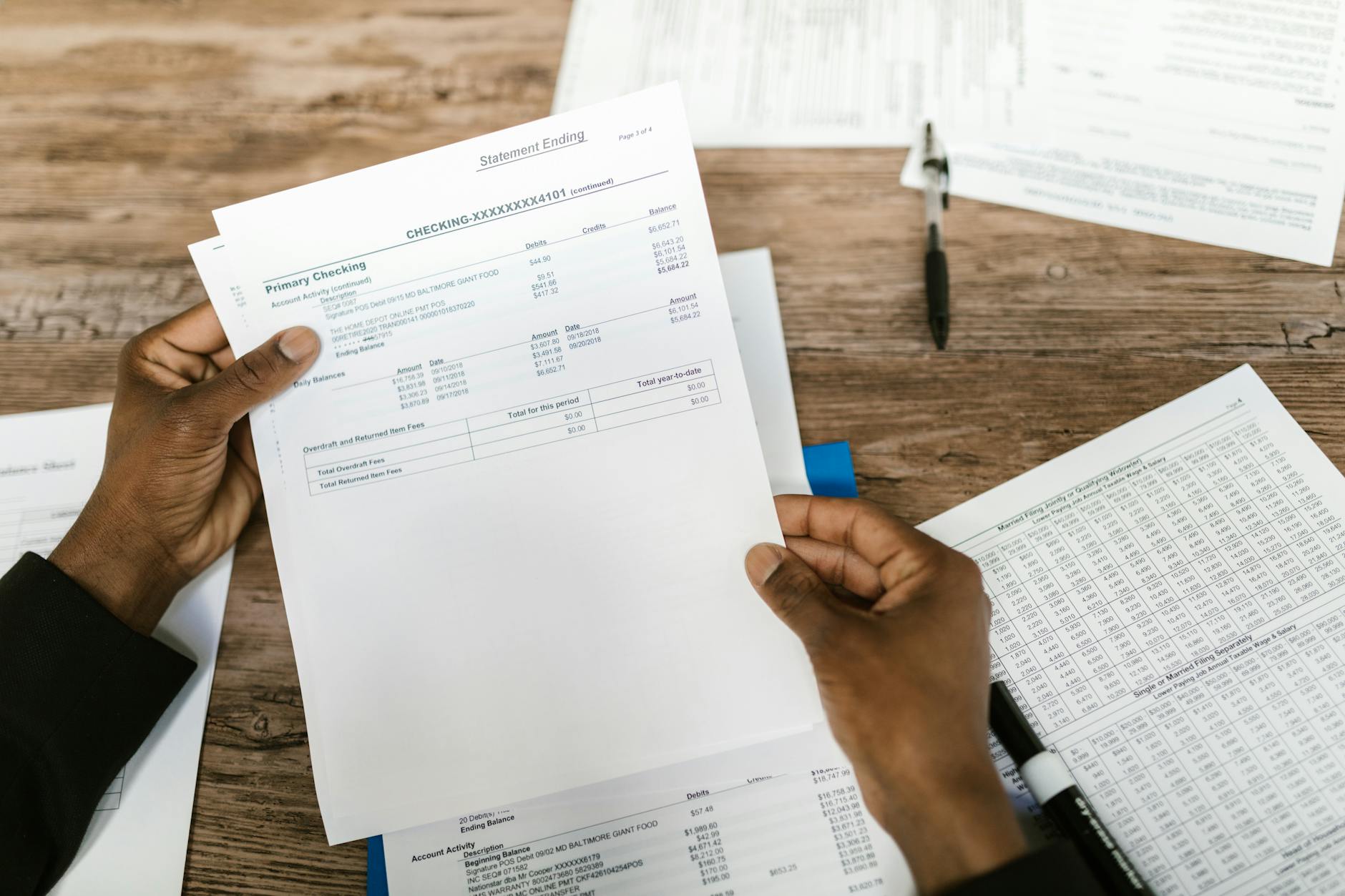 Financial planning documents and calculator representing HSA investment and retirement strategy