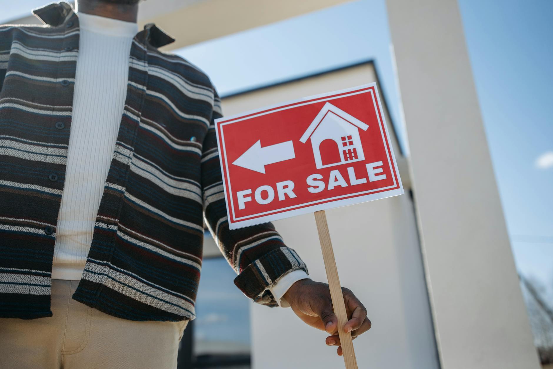 Commercial real estate for sale sign indicating distressed property market conditions