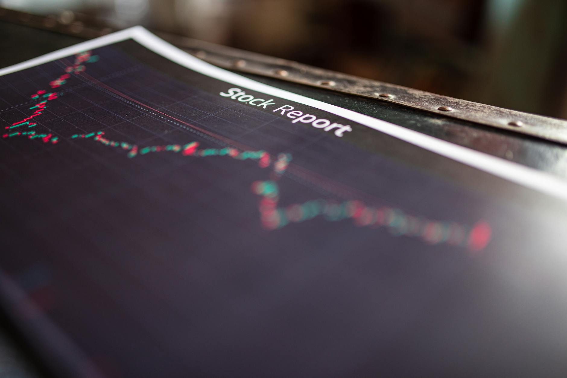 Financial trading charts and graphs displayed on computer monitors