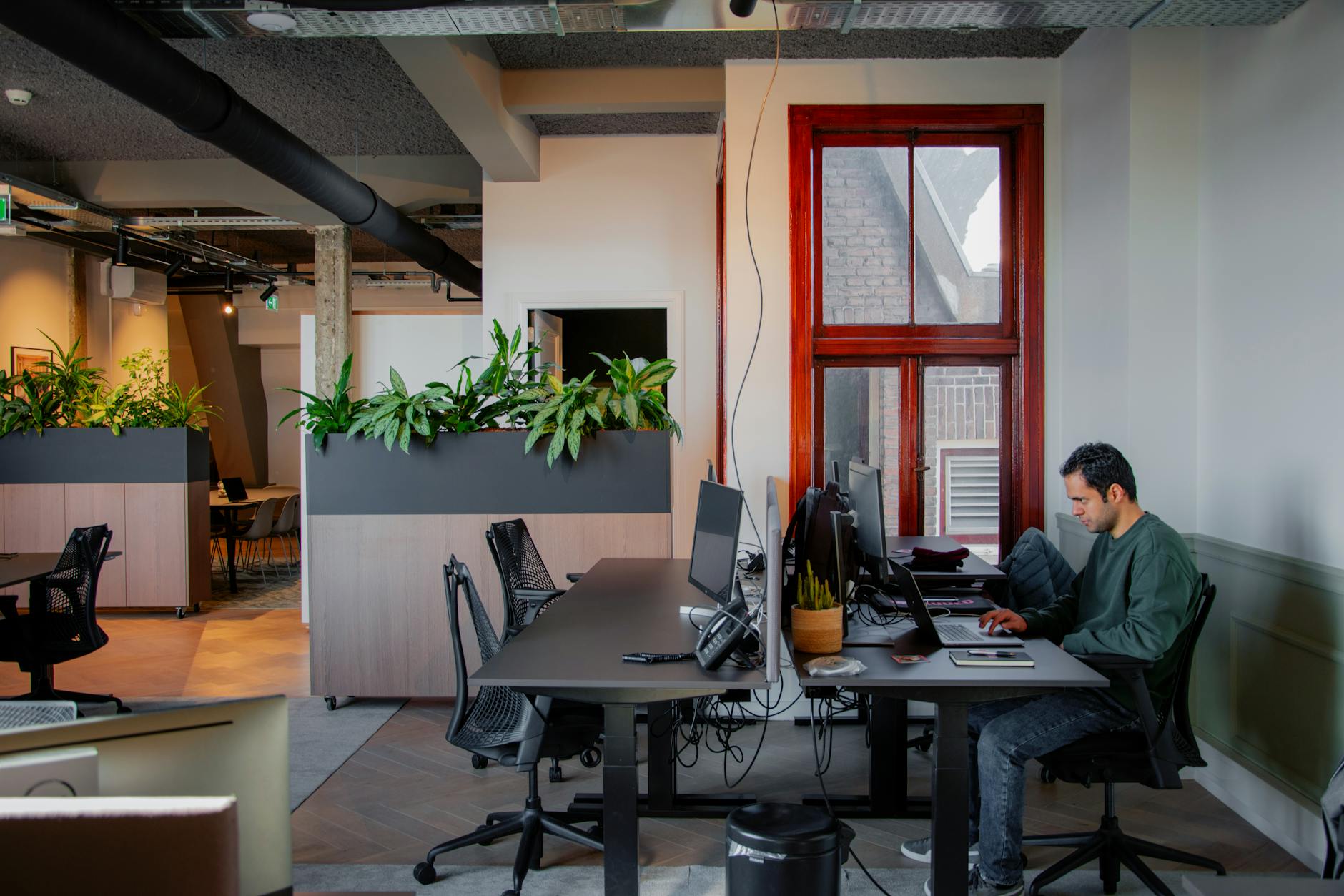 Modern office building with green architectural features and sustainable design elements