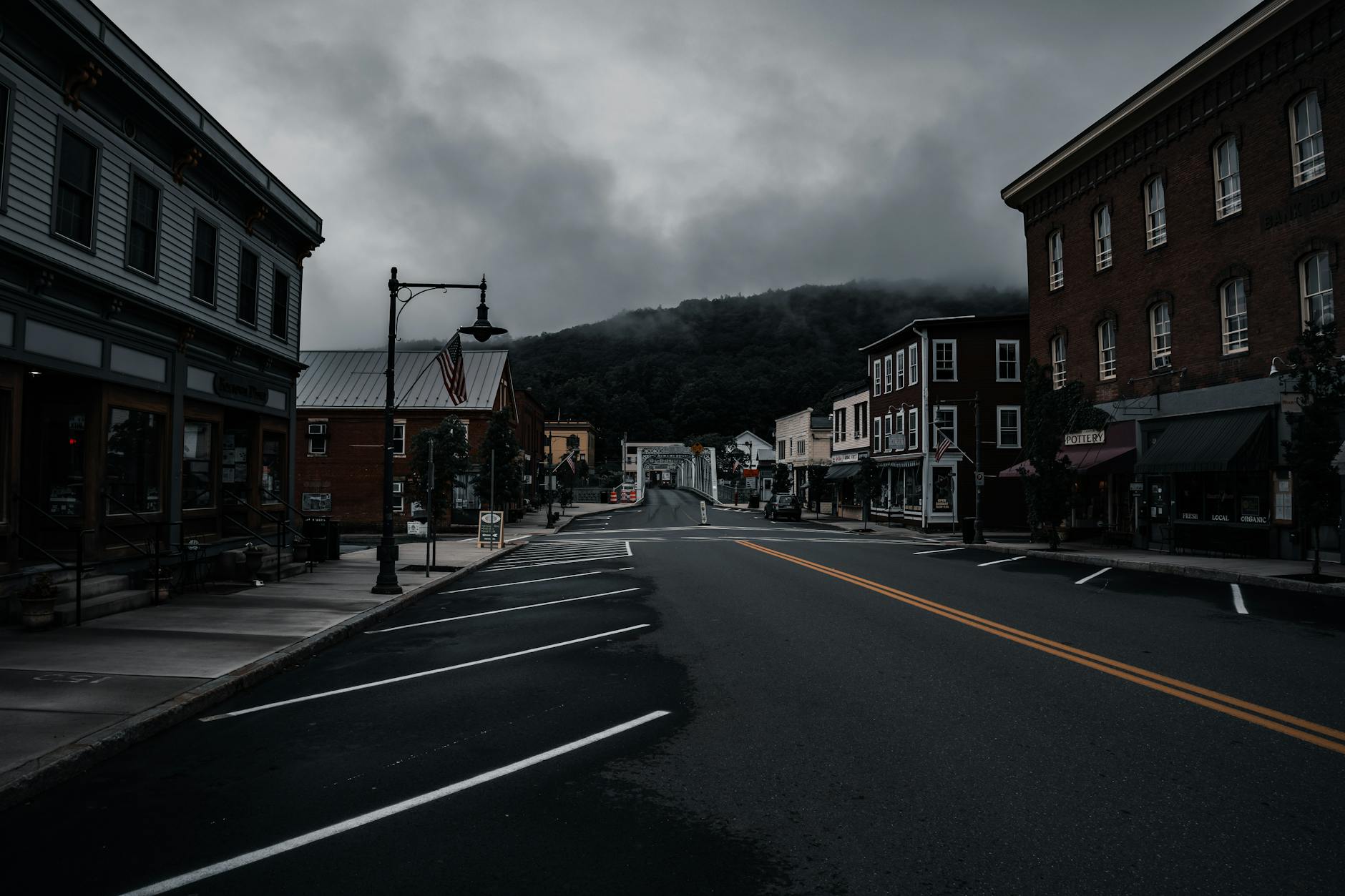 Main street view of small American city with local businesses and storefronts