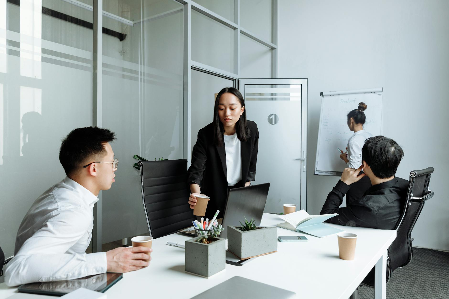 Tech professionals collaborating in modern office environment