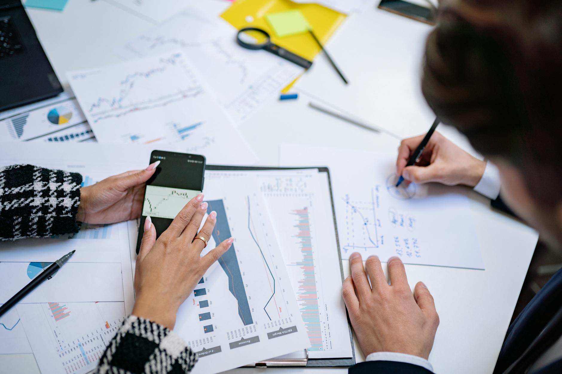 Professional financial advisors meeting with clients to discuss investment strategies