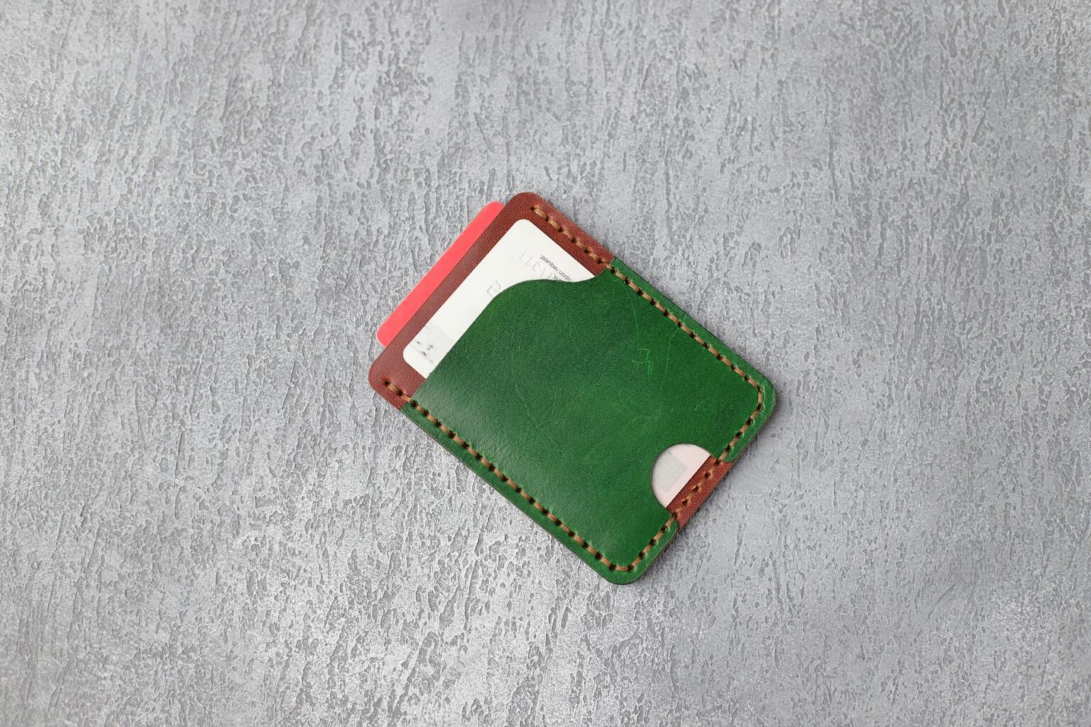 Multiple credit cards arranged in a leather wallet showing various card designs