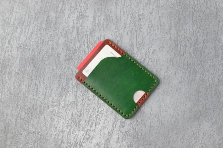 Multiple credit cards arranged in a leather wallet showing various card designs