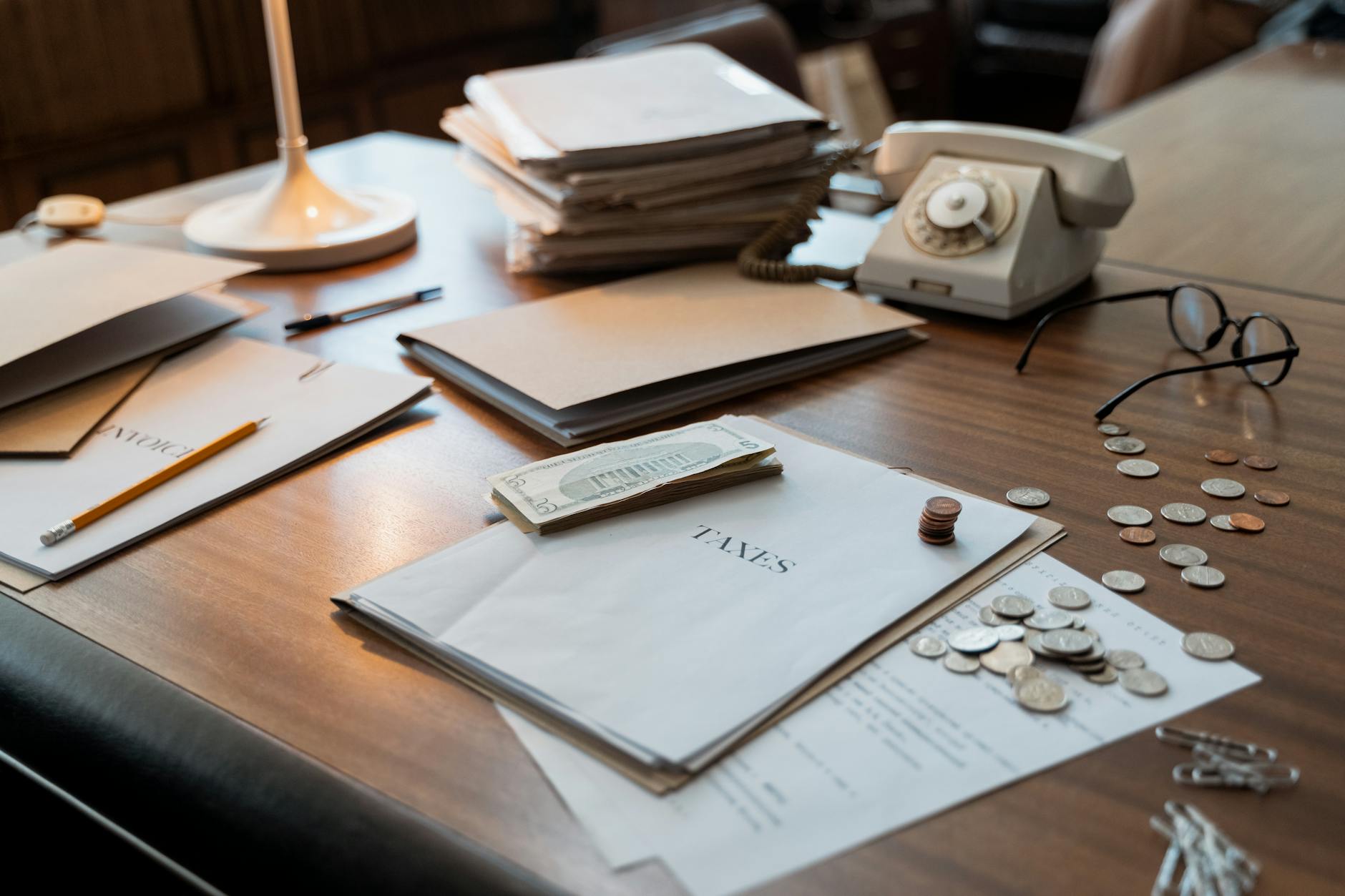 Financial documents and reports spread across a desk representing fund governance review
