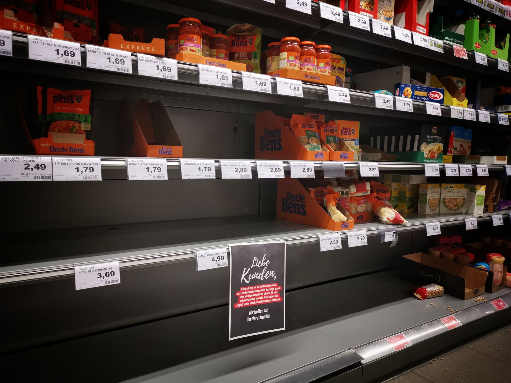 Fully stocked shelves in a conventional supermarket grocery store