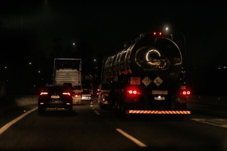 Commercial semi-truck driving on a highway representing the U.S. freight transportation industry