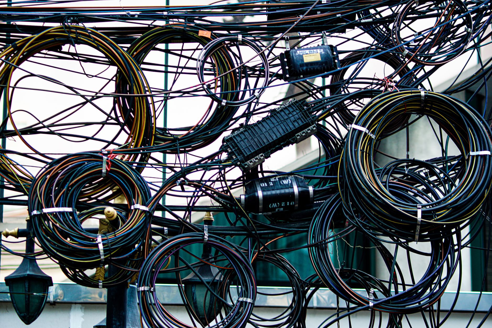 Coiled copper wire in an industrial setting representing raw material demand