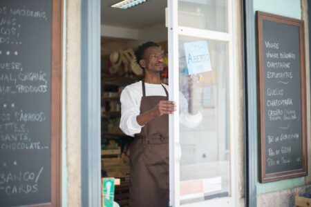 Small business owner reviewing financial documents at a desk