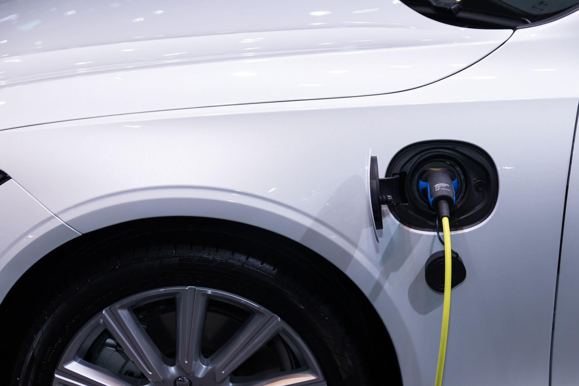Electric vehicle plugged into a charging station illustrating EV infrastructure demand