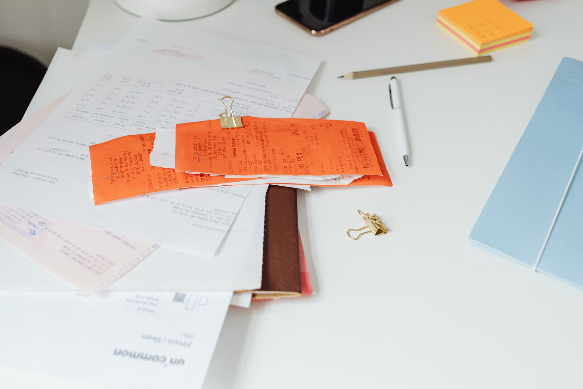 Financial documents and charts on a desk representing bridge loan underwriting and commercial lending analysis