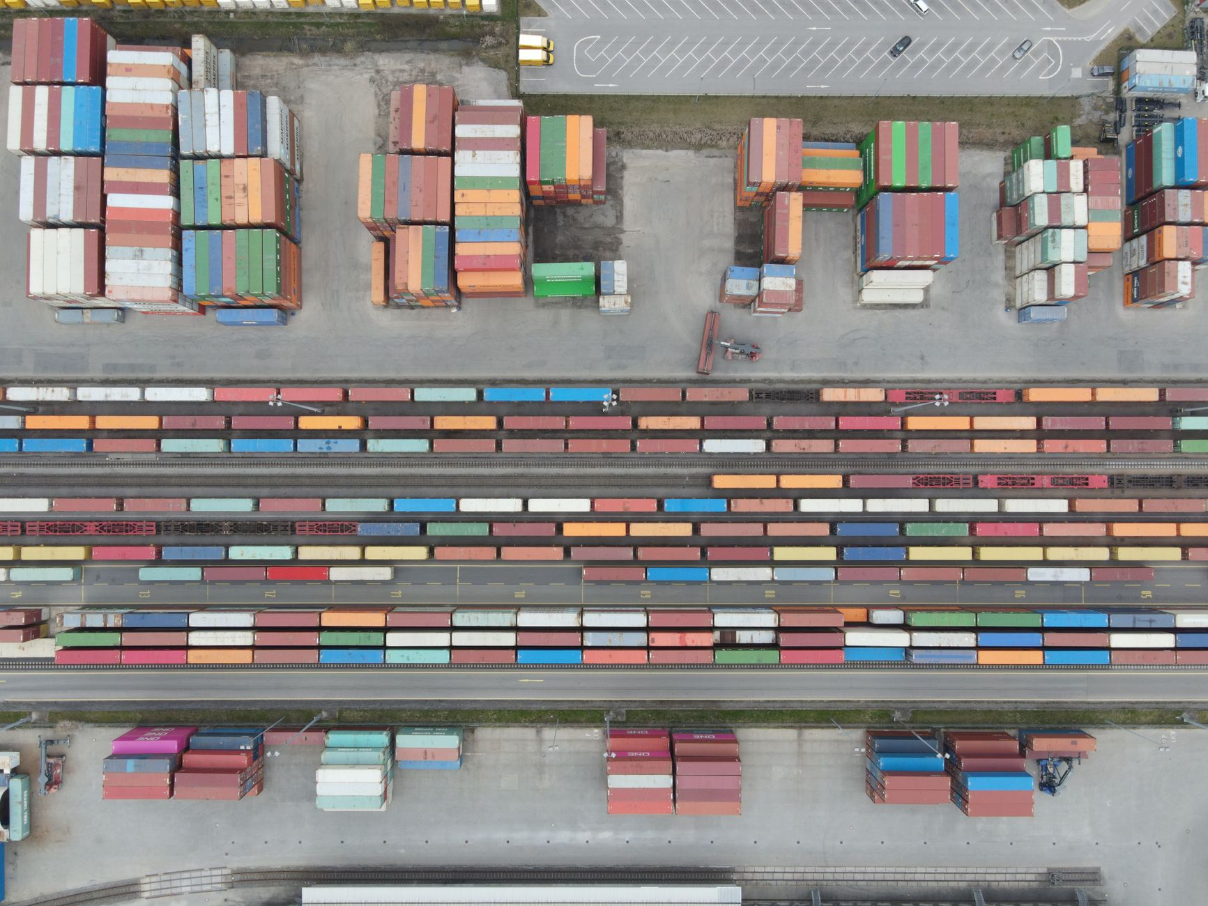 Intermodal shipping containers stacked at a rail freight yard