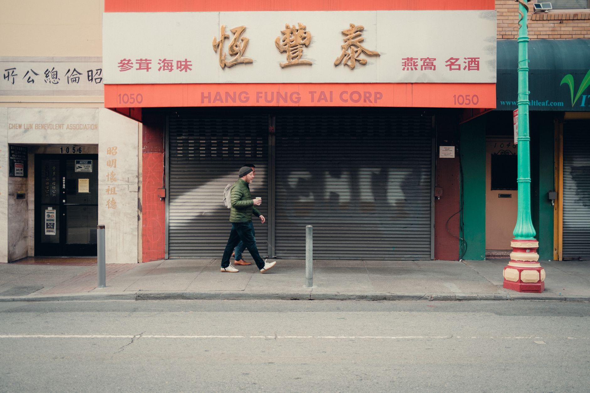 Vacant commercial storefront with closed signage on a quiet street