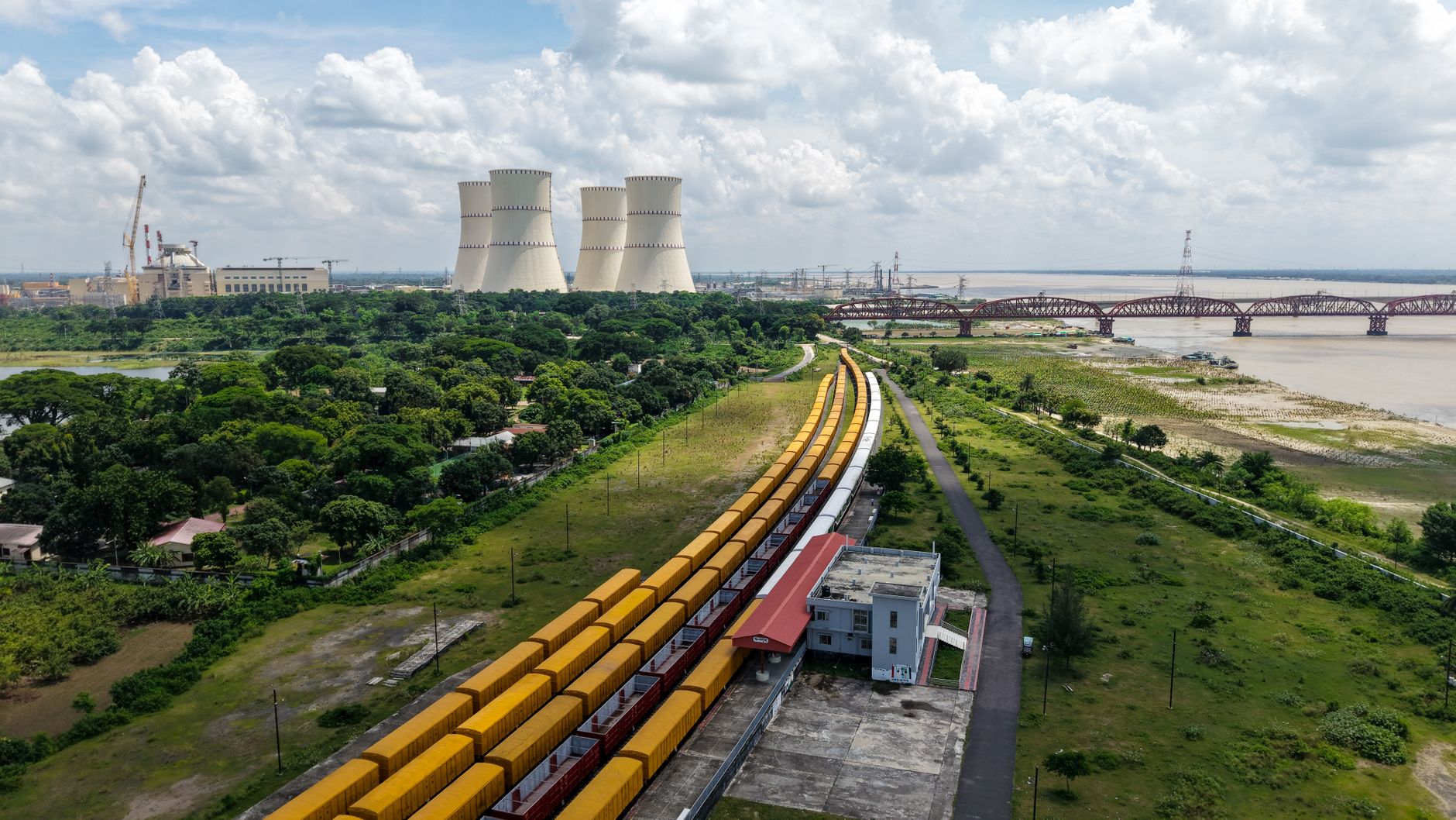 Aerial view of a natural gas power plant with cooling towers