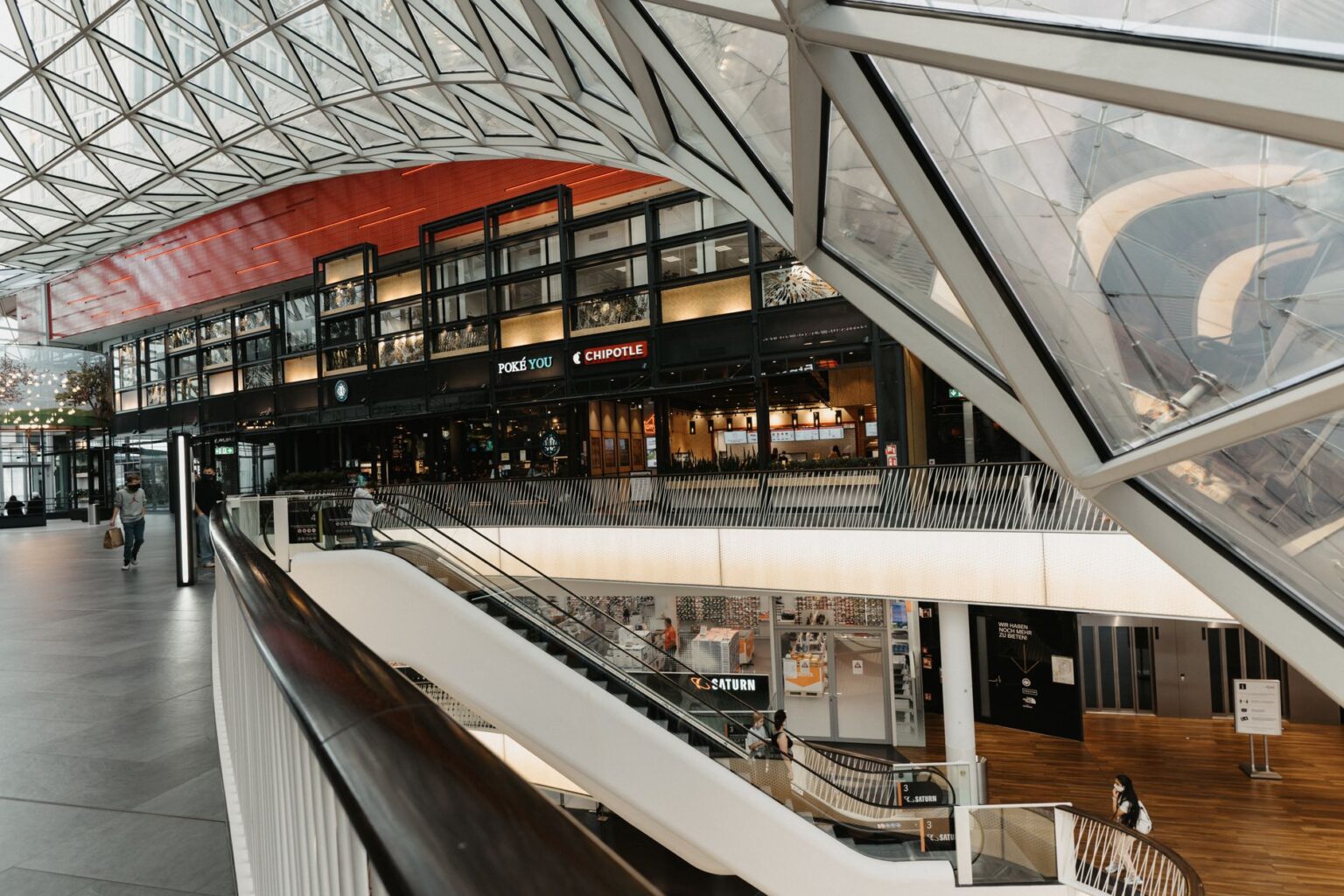 Retail Foot Traffic Slump Deepens as Discount Fatigue Sets In Nearly empty shopping mall corridor with few visible shoppers