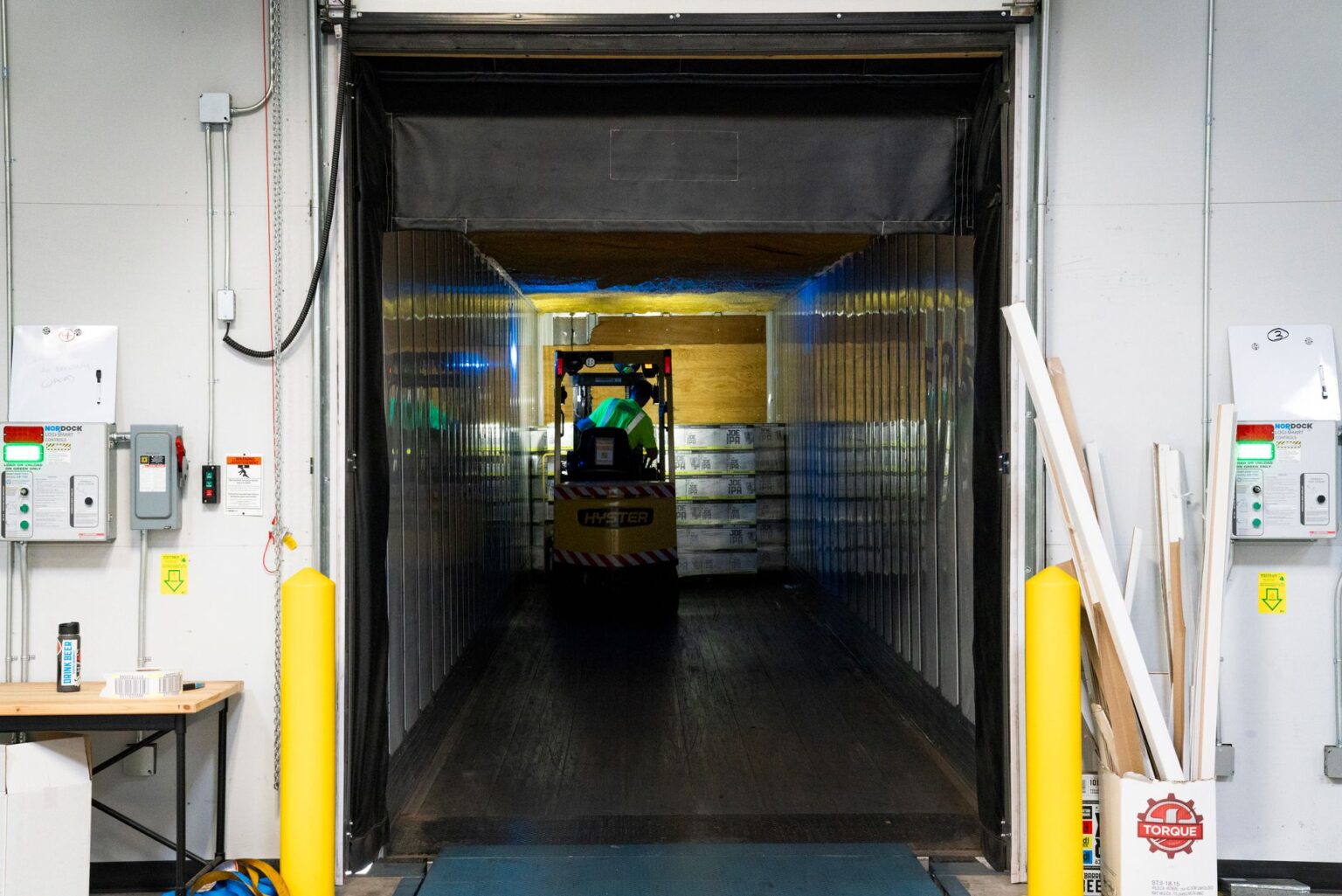 Warehouse Sublease Glut Signals Cooling Industrial Real Estate Boom Large empty warehouse interior with high ceilings and loading dock doors